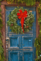 Seasonal decorations on an old rustic door in El Prado, Taos County... 5 x 7 greeting card